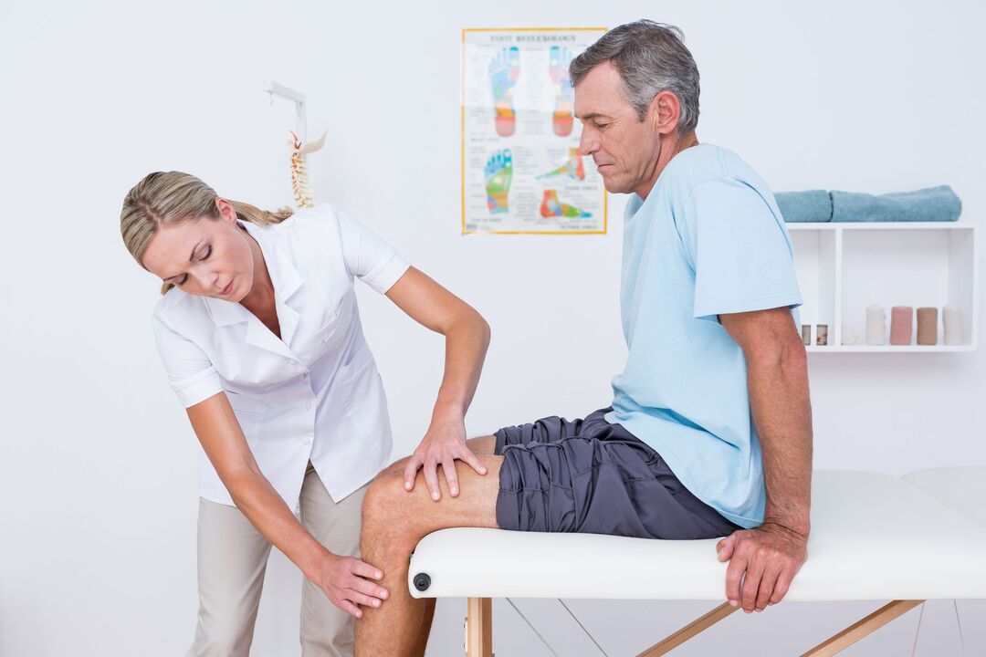 Doctor examining a patient with knee arthritis